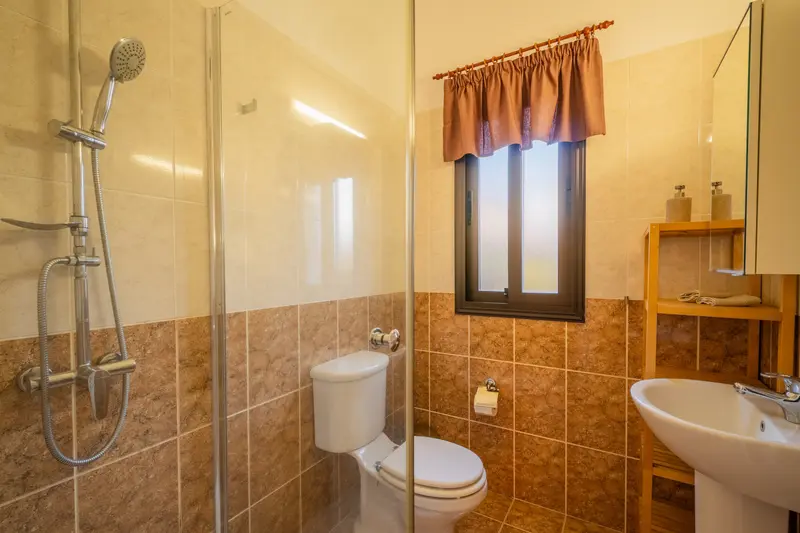 Full bathroom with walk-in shower. Heated towel rails. Ensuite to the green bedroom.