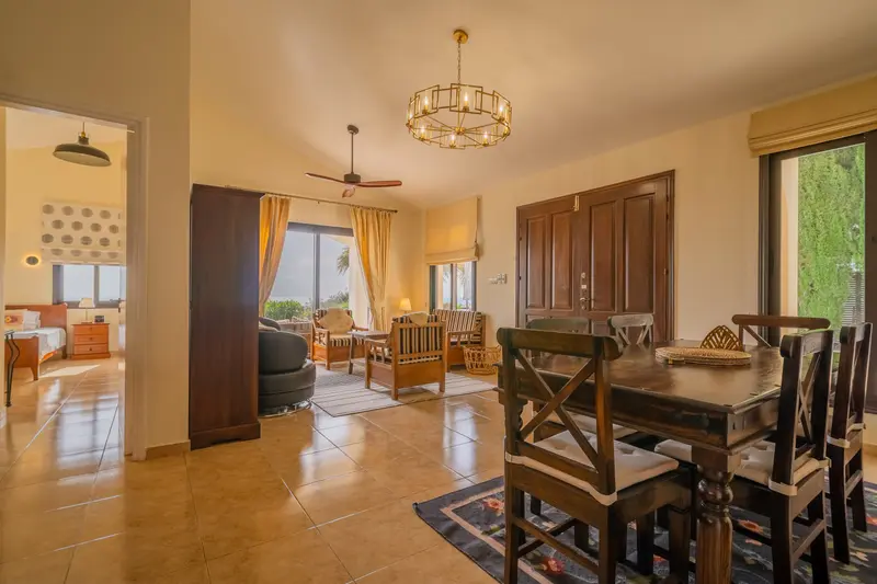 Open, airy, and social layout of main room with high ceilings.