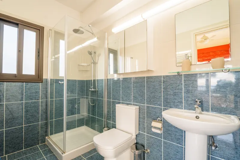 Full bathroom with walk-in shower and heated towel rails connected to the master bedroom.