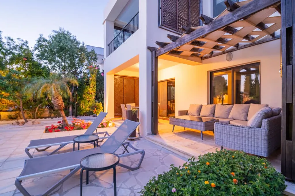 Terrace with sun loungers and outdoor lounge seating at Villa Pontus
